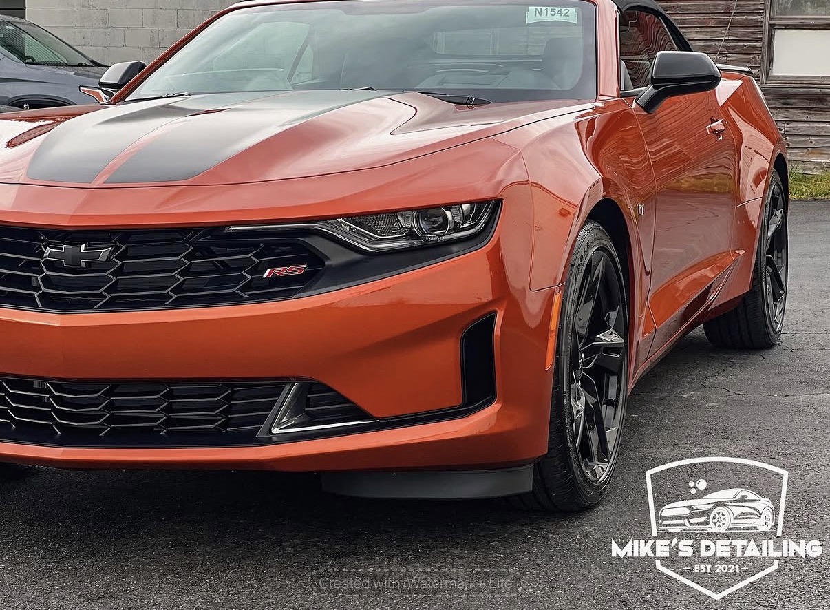 Orange Chevrolet Camaro front angle after detail