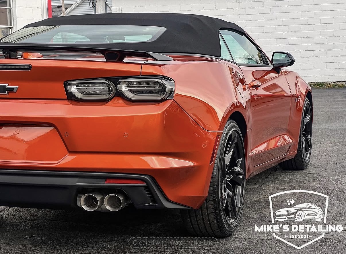 Orange Chevrolet Camaro taillight and rear body detail
