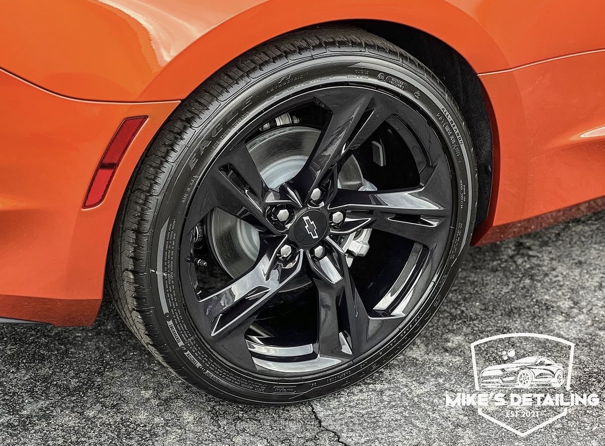 Orange Chevrolet Camaro cleaned wheel and tire