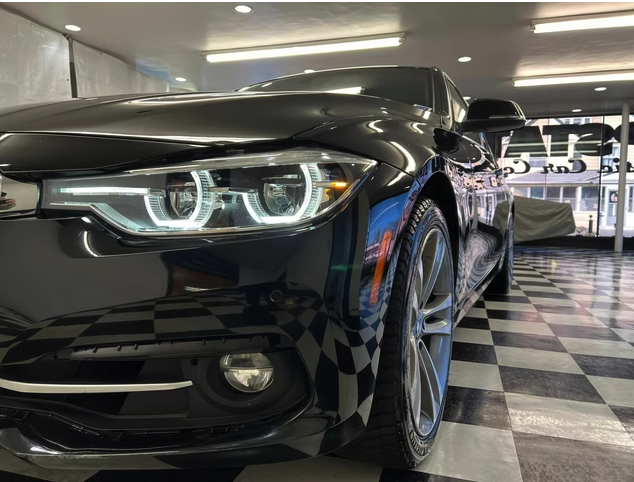 Black BMW front end polished after detailing