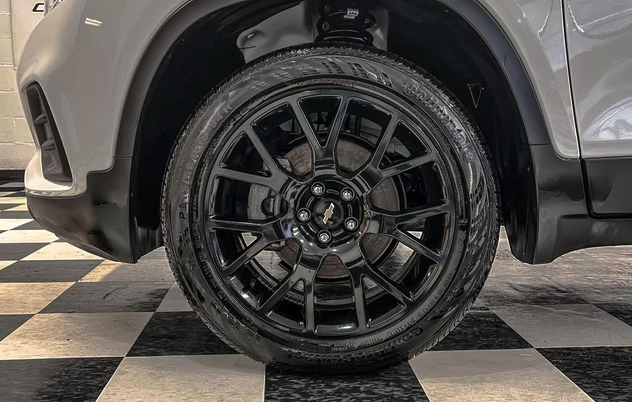 Black Chevrolet wheel and tire after detailing