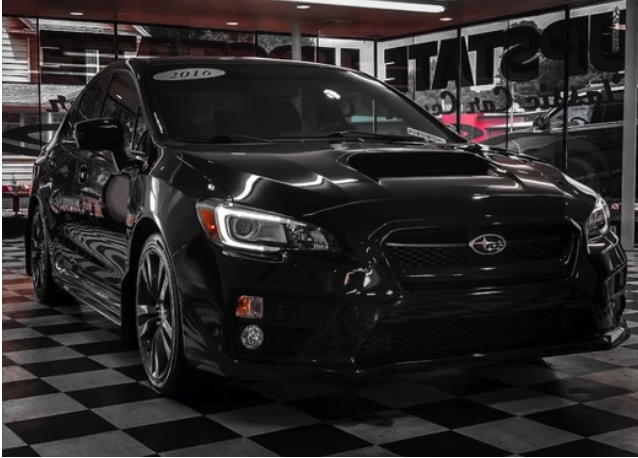 Black Subaru WRX detailed in the shop