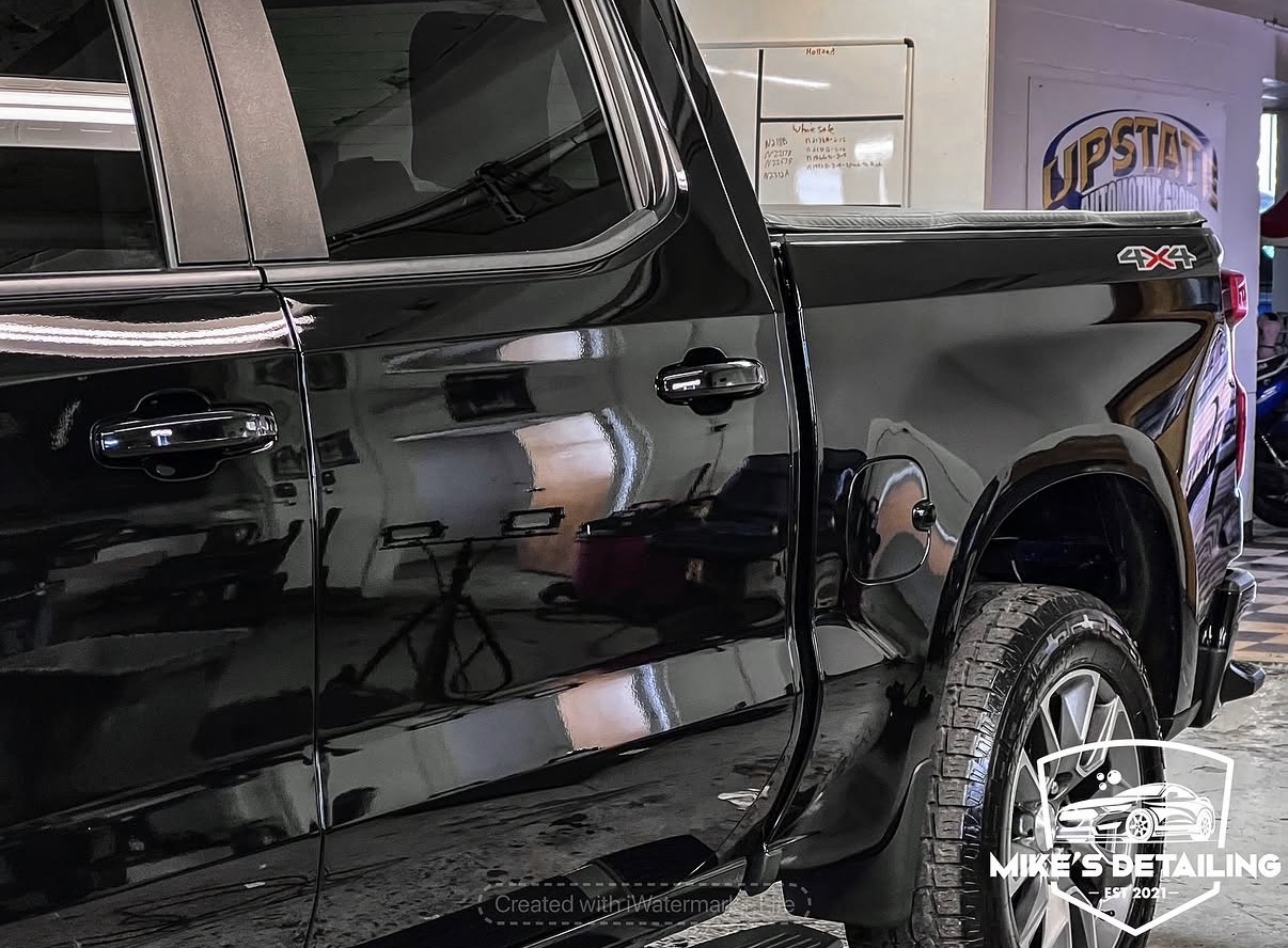 Black truck after paint correction side reflection